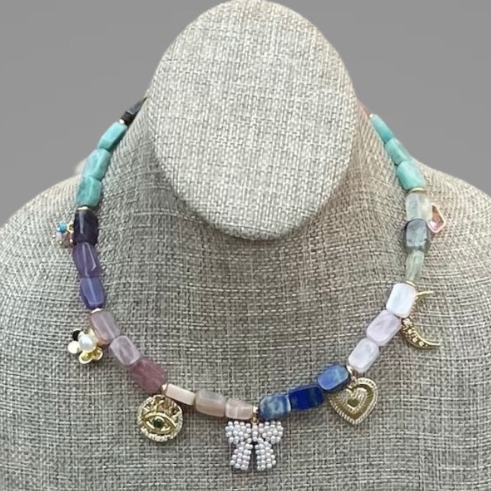 Gemmy Charms Necklace: Multiple gemstones and gold accents Adorable charms